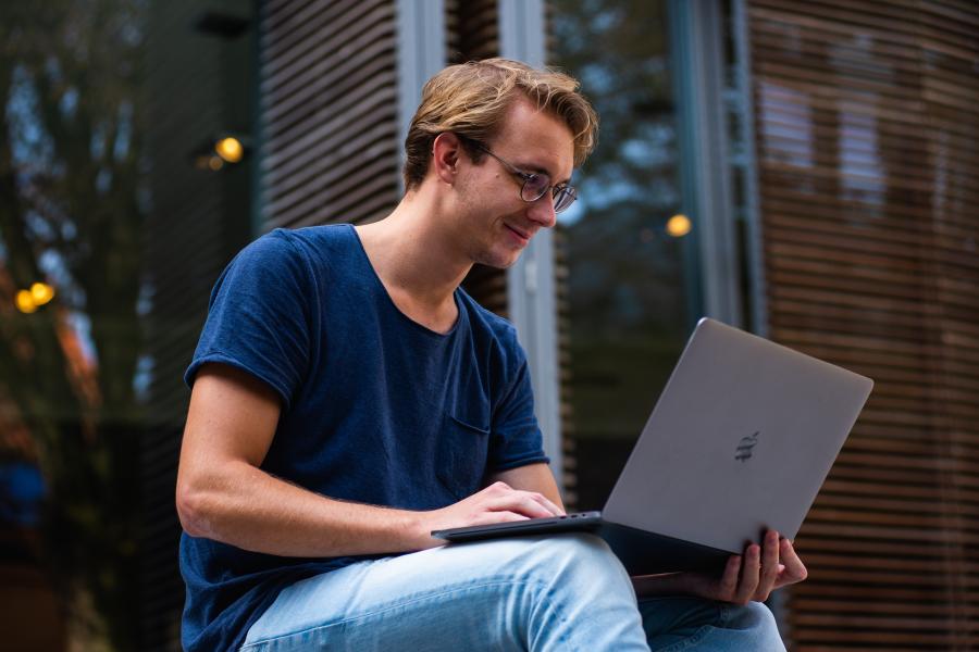 student looking at laptop