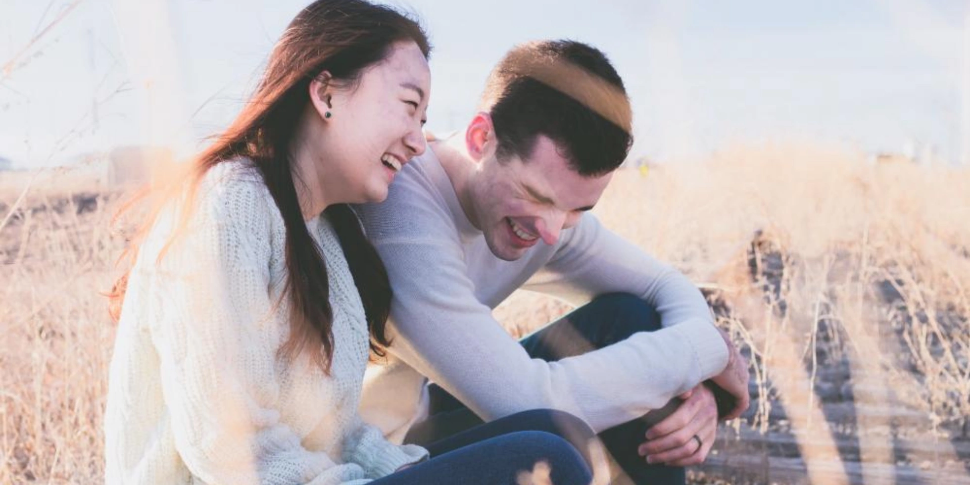 A couple laughing about funny german words