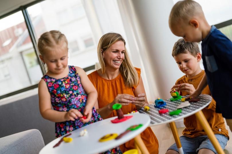 a mother playing with kids