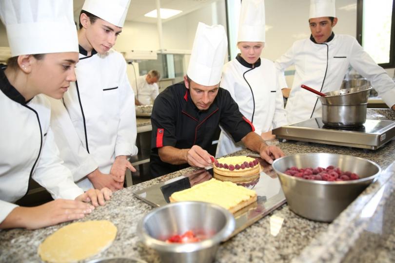 several cooks cooking